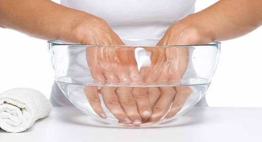 soak hands in warm water