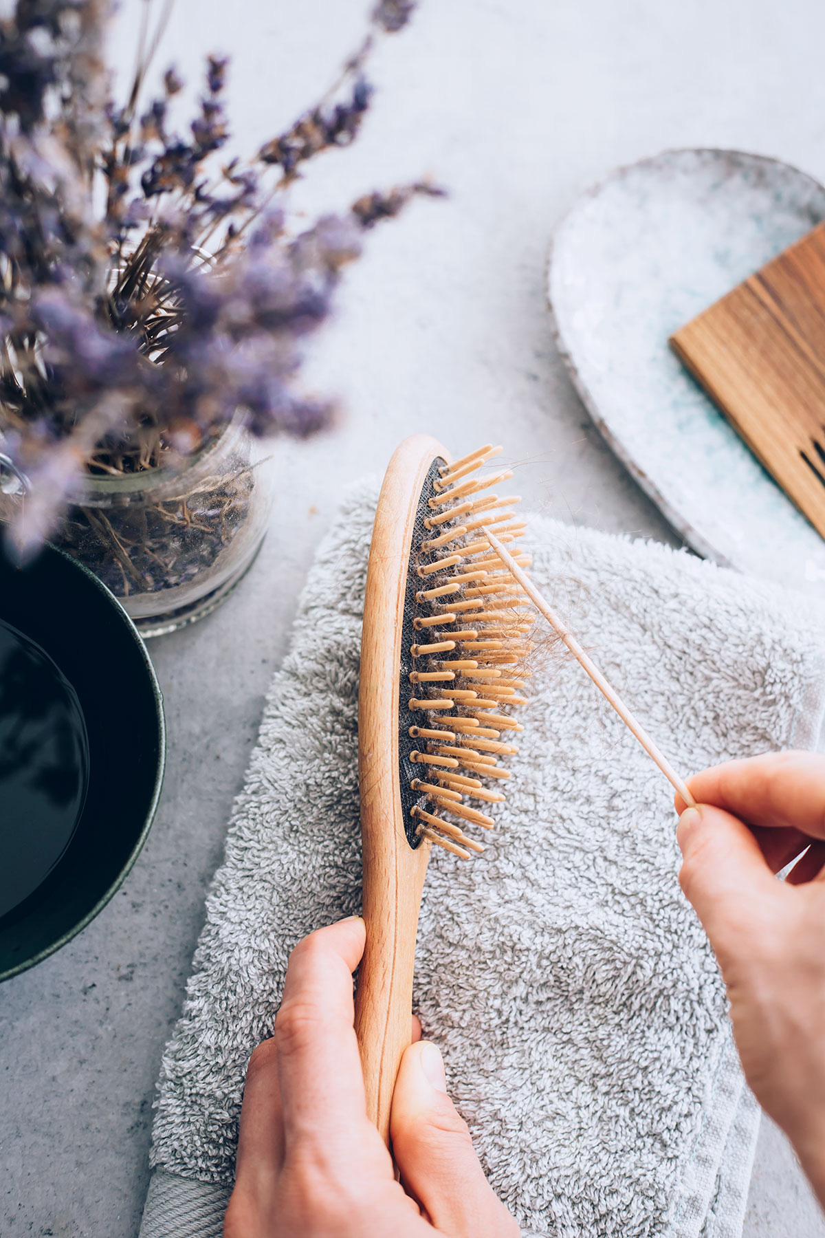 clean hairbrush with toothpick