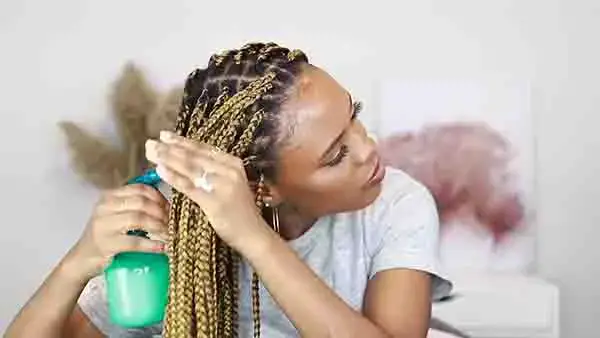 Spread water on your hair with a hair sprayer